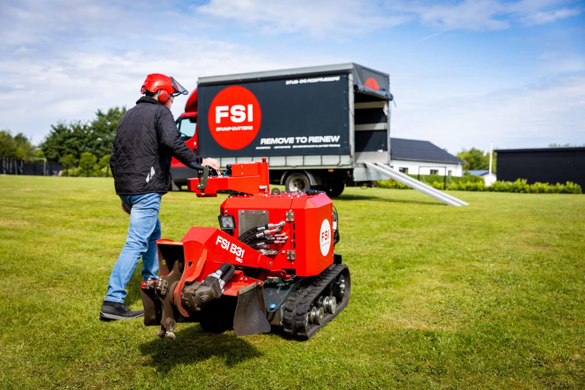 FSI B31-980 tracked stump grinder being walked to transport trailer